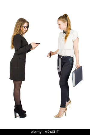 Beauty blonde businesswomen holding documents and interacting. Concept of teamwork. Stock Photo