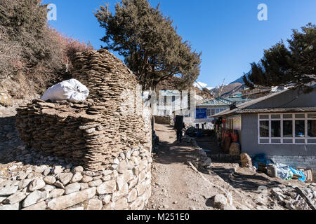 A pile of yak dung waiting to be used as fuel in a fireplace. Nepal Stock Photo