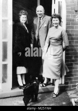 File photo dated 18-04-1958 of Manchester United manager Matt Busby at his home in the city, after returning from Munich. He has been recovering from injuries sustained in the Munich air disaster that claimed the lives of eight of his team. With him are his wife Jean and daughter Sheena. Stock Photo