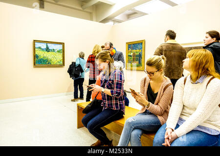 People in Museum modern art bench Prague National Gallery Vincent van Gogh paintings Czech Republic People Stock Photo