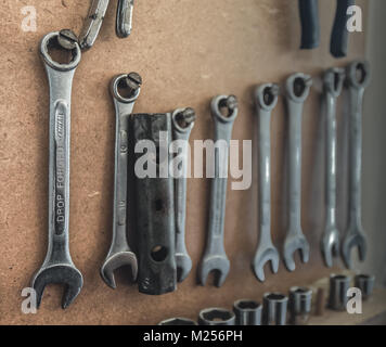 Tools hanging in workshop in naturalistic setting Stock Photo