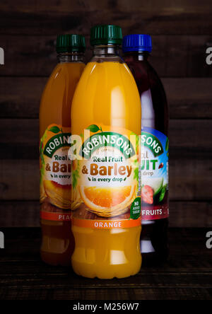 LONDON, UK - FEBRUARY 02, 2018: Bottles of Robinsons Fruit Juices with on wooden background. Stock Photo