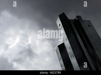 FILED - FILE: A file picture dated 31 July 2012 shows dark clouds over the headquarters of Deutsche Bank in Frankfurt am Main, Germany. Photo: Arne Dedert/dpa Stock Photo