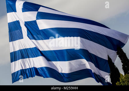 A giant Greek flag of 150 square meters area is seen hanging over the crowd. Greeks gather massively in Syntagma Square to demonstrate against the use of the name 'Macedonia' by FYROM. The final name of the former Yugoslav state is decisive about its entering in NATO.   Photo: Cronos/Kostas Pikoulas Stock Photo