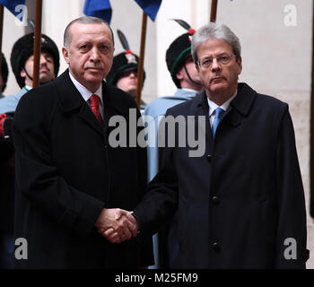 Rome, Italy. 5th Feb, 2018. Italian Prime Minister Paolo Gentiloni (R) shakes hands with visiting Turkish President Recep Tayyip Erdogan during their meeting in Rome, Italy, on Feb. 5, 2018. Turkish President Recep Tayyip Erdogan paid a 24-hour visit to the capital city and Vatican City on Monday, with a major focus on Turkey's accession to the European Union (EU) and the status of Jerusalem. Credit: Alberto Lingria/Xinhua/Alamy Live News Stock Photo