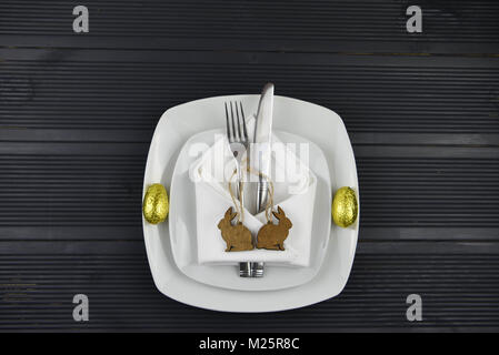 Easter time table place setting with decorations Stock Photo
