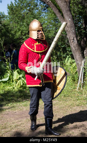 Glistening Knight holding handed sword Stock Photo