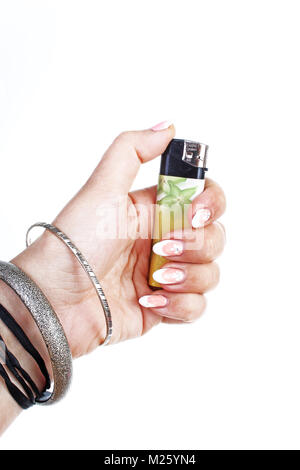 .Woman hand holding lighter on isolated white cutout background. Studio photo with studio lighting easy to use for every concept.. Stock Photo