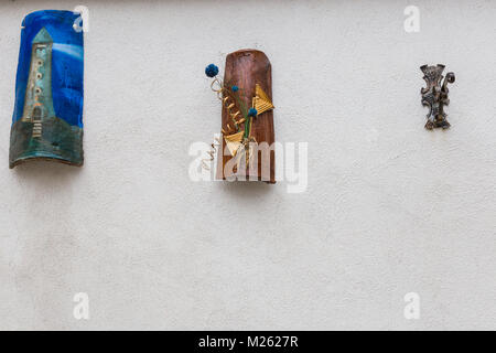 Villetta Barrea, Abruzzo, Italy. October 13, 2017. Artistic decorations attached to the wall of a dwelling Stock Photo