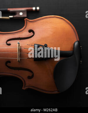 old Violin with bow on wooden table Stock Photo