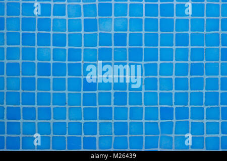 Close up of mosaic blue tiles in the pool; summer wallpaper Stock Photo