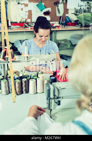 Portrait of two professional female tailors working in a sewing workshop Stock Photo