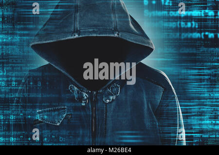 Cybersecurity, computer hacker with hoodie and obscured face, computer code overlaying image Stock Photo