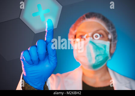 Healthcare worker using modern innovative technology in medicine, female doctor working on virtual screen Stock Photo