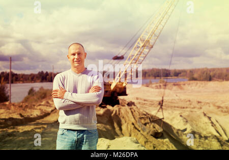 Portrait of worker  at sand pit Stock Photo