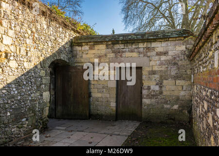 Small alleyway path leading from Winchester Cathedral to Colebrook Street in historic old part of Winchester, Hampshire, England, UK Stock Photo