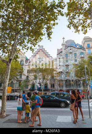 Barcelona, Spain - August 25, 2014: Tourists walk on Passeig de Gracia one of the major avenues in Barcelona, Catalonia Stock Photo