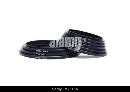 Aluminium camera lens filter ring adapters 49mm to 82mm isolated on white Stock Photo