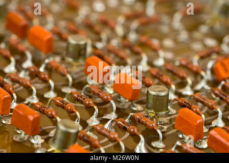 Vintage electronic components on printed circuit board Stock Photo