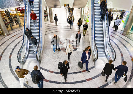 London, UK -  February 25, 2018 - Cabot Place in Canary Wharf with people up and down on escalators Stock Photo