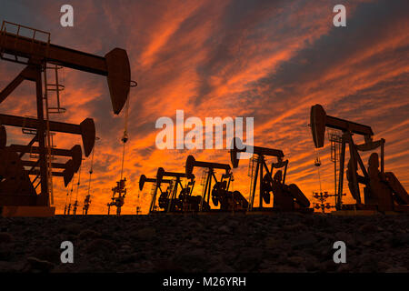 3D render of pump jacks in an oil field Stock Photo