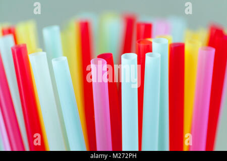 Close-up of many multicolored straws for cocktails. Macro. Stock Photo