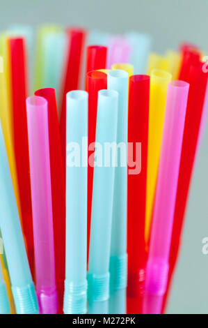 Close-up of many multicolored straws for cocktails. Macro. Stock Photo