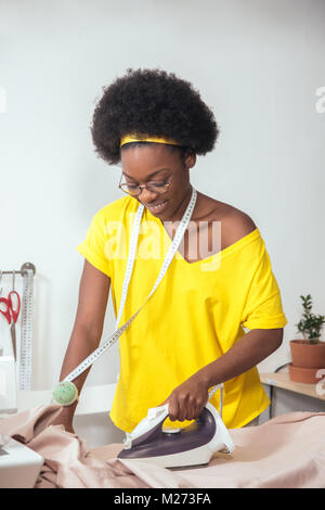 african Woman seamstress Ironing cloth