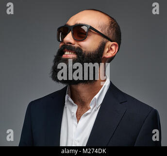 Portrait of a bearded male isolated on grey background. Stock Photo