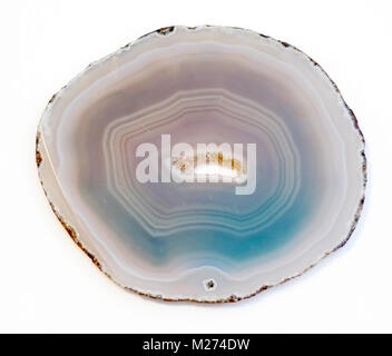 Vibrant and shiny agate rock slice isolated on white background. Calgary, Alberta, Canada. Stock Photo