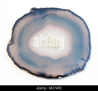 Vibrant and shiny agate rock slice isolated on white background. Calgary, Alberta, Canada. Stock Photo