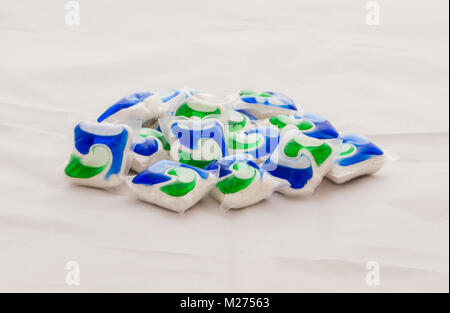 Largs, Scotland, UK - February 03, 2018: A pile of persl dishwasher tablets on a linen cloth surface. Stock Photo