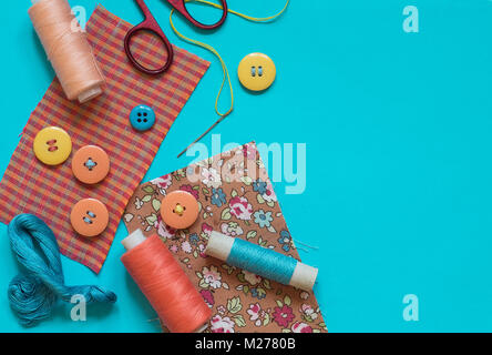 Sewing supplies on mint background, top view Stock Photo by AtlasComposer