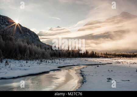 Sunrise on Eagle River valley and Polar Bear peak in Chugach State Park at Eagle River Nature Center in Southcentral Alaska. Stock Photo