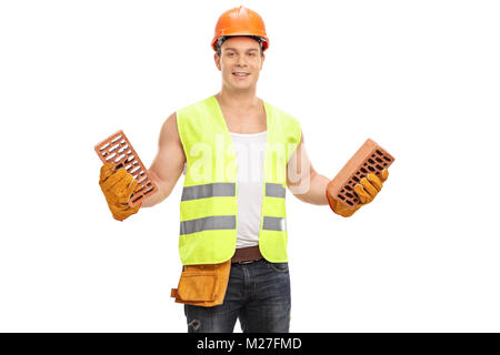 Construction worker holding bricks isolated on white background Stock Photo