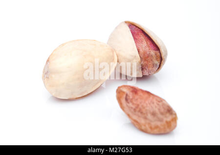 Fresh salthy pistachio nuts on white background with shell Stock Photo