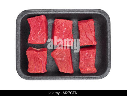 Pieces of fresh raw beef meat in plastic tray on white background Stock Photo