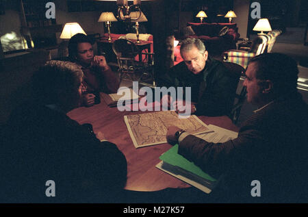 United States President George W. Bush meets with National Security Advisor Dr. Condoleezza Rice (left), White House Chief of Staff Andy Card (center) and Central Intelligence Agency (CIA) Director George Tenet (right) at Camp David, Maryland, Saturday, September 29, 2001..Mandatory Credit: Eric Draper - White House via CNP. /MediaPunch Stock Photo