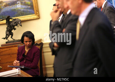 Washington, DC - December 19, 2008 -- United States Secretary of State Condolezza Rice listens as United States President George W. Bush meets with the President Mahmoud Abbas (Abu Mazen) of the Palestinian Authority in the Oval Office of the White House in Washington DC on Friday, December 19, 2008..Credit: Ken Cedeno / Pool via CNP /MediaPunch Stock Photo