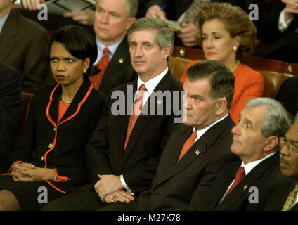 Washington, DC - January 28, 2003 -- Members of the Bush Cabinet and Republican United States Senators listen as United States President George W. Bush delivers his State of the Union Address to a Joint Session of the United States Congress. From left to right: National Security Advisor Condoleezza Rice, White House Chief of Staff Andy Card, Secretary for Homeland Security Tom Ridge, unidentified, and Secretary of Education Rodney Paige.  Behind them, from left are U.S. Senator Jeff Sessions (Republican of Alabama) and Elizabeth Dole (Republican of North Carolina) Credit: Ron Sachs / CNP /Medi Stock Photo