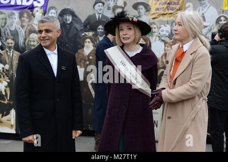 Mayor of London, Sadiq Khan, Curator of the Historic Royal Palaces Lucy Worsley and Deputy Mayor Justine Simons (right) at the opening of an exhibition in Trafalgar Square, London to mark the centenary of women&Otilde;s suffrage. Stock Photo
