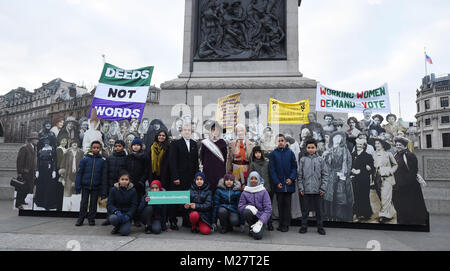 Women's activist Amika George, Mayor of London, Sadiq Khan, Curator of the Historic Royal Palaces Lucy Worsley (second right) and Deputy Mayor Justine Simons (right) with children from Milbank Academy at the opening of an exhibition in Trafalgar Square, London to mark the centenary of women's suffrage. Stock Photo