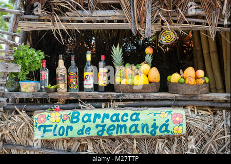 BAHIA, BRAZIL - FEBRUARY 11, 2016: Rustic Brazilian beach shack named Flor de Iemanja sells alcoholic drinks made with tropical fruit Stock Photo