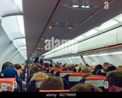 Passengers in the cabin of an Easyjet Airbus A320 commercial airliner.