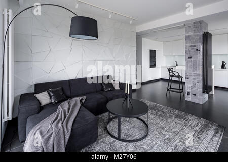 Living room and kitchen in open space modern apartment Stock Photo
