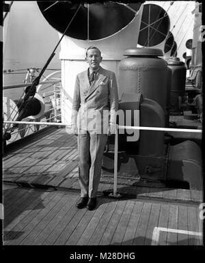 The actor, playwright and singer Noël Coward in 1927 aboard the S.S. Mauritania. In 1906 at the time of her launch, the Mauretania was the largest structure yet built, slightly larger than her sister ship Lusitania. Stock Photo