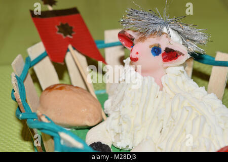 close up of marzipan Easter lamb and fruit in a basket Stock Photo