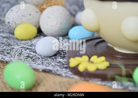 chocolate egg in the shape of a lamb with various decorations Stock Photo