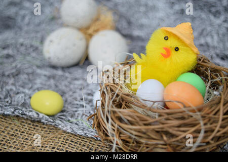 chocolate eggs of various colors with decorations Stock Photo