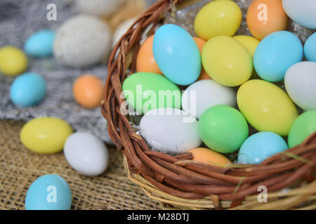 chocolate eggs of various colors with decorations Stock Photo